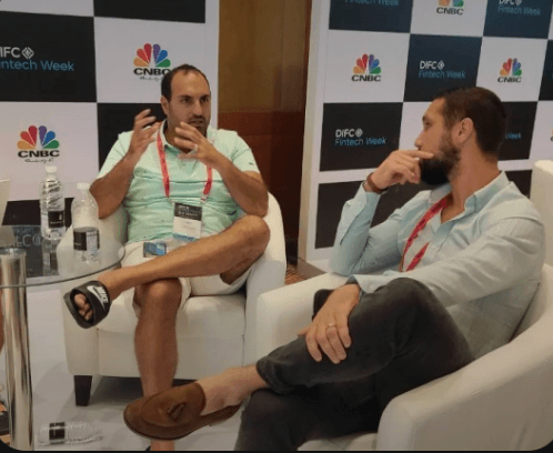 James G seated on the right during a panel discussion with another speaker