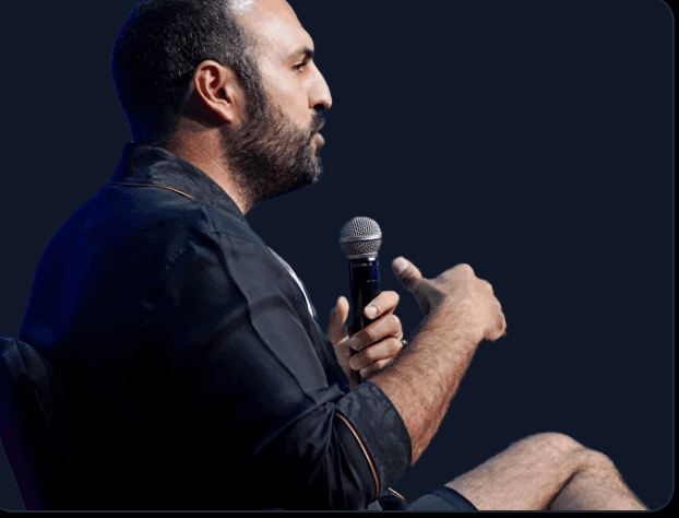 JamesG Show addressing attendees at a crypto trading event